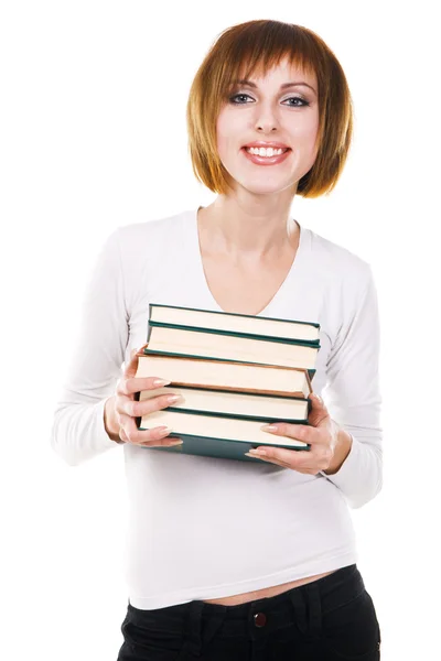 Estudante bonito com uma pilha de livros — Fotografia de Stock
