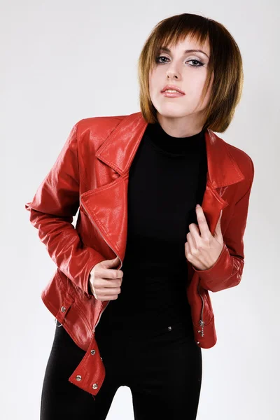 Beautiful model in red leather jacket — Stock Photo, Image