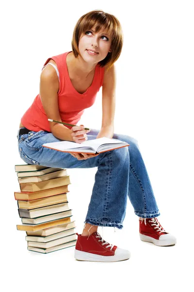 Estudante adorável com muitos livros — Fotografia de Stock