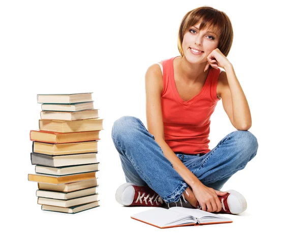 Schöne Studentin mit einem Stapel Bücher Stockfoto