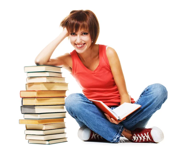 Schöne Studentin mit einem Stapel Bücher Stockbild