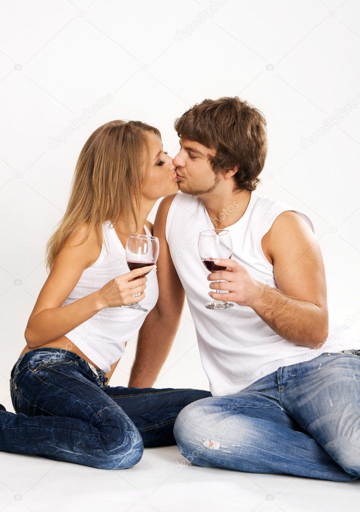 Cheerful young couple drinking wine
