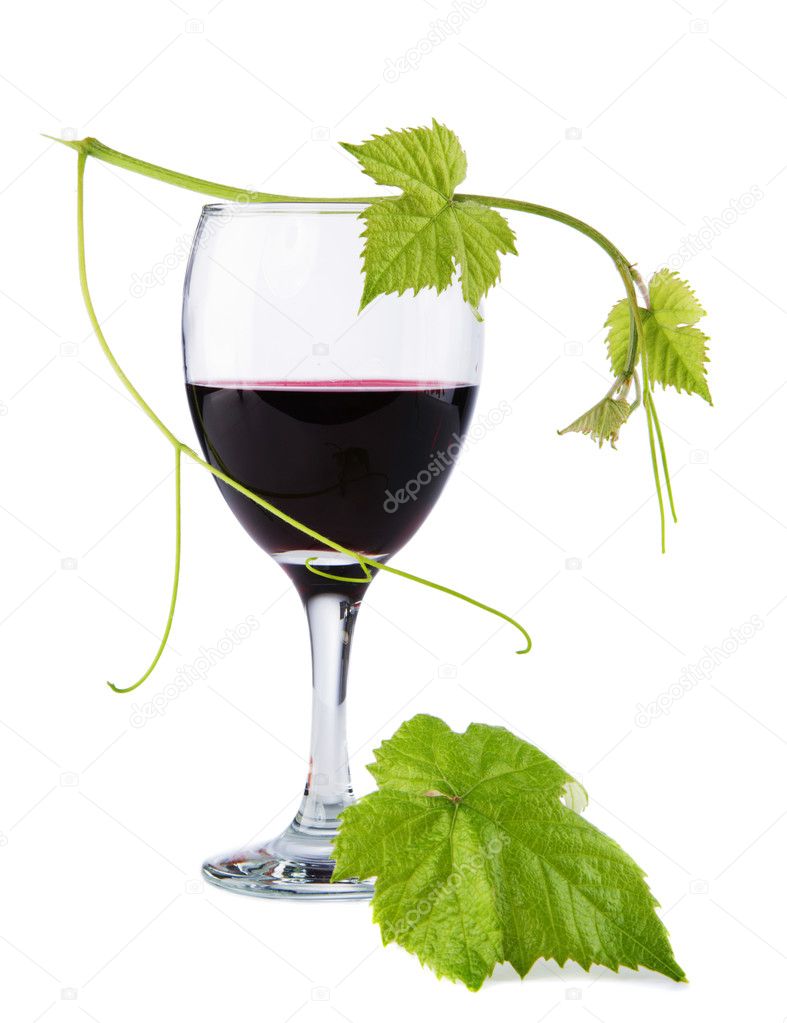 Glass of red wine, with a green leaf