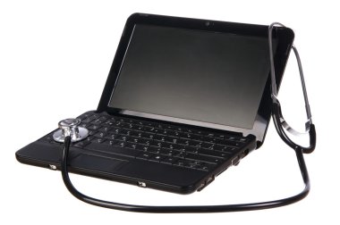 Modern netbook with a stethoscope over it clipart