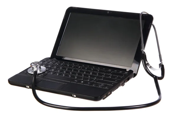 Modern netbook with a stethoscope over it Royalty Free Stock Images