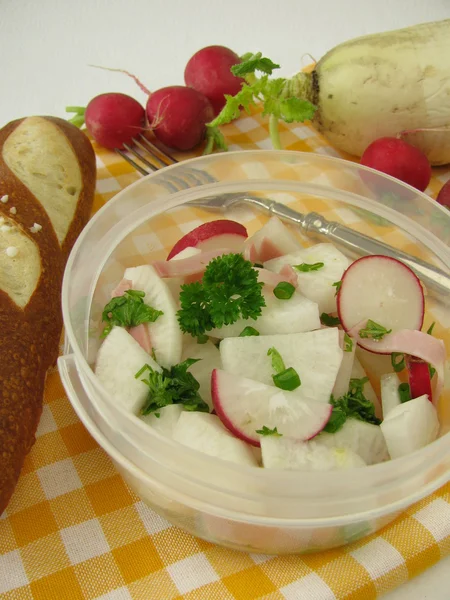 Picnic with radish salad and lye roll — Stock Photo, Image