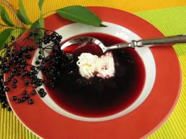 Fruit soup with elderberries clipart