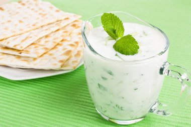 Tzatziki dip and matzo bread clipart