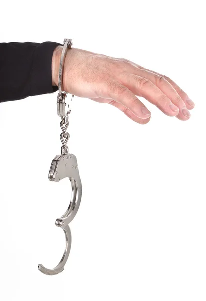 Рука вора в наручниках — стоковое фото