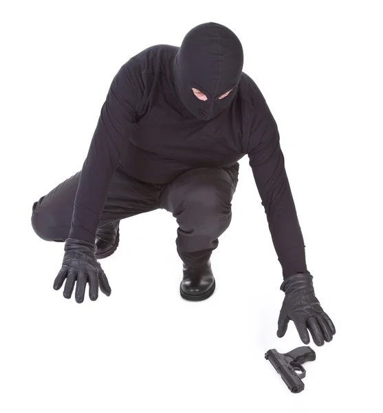 Bandit is trying to recover his weapon — Stock Photo, Image