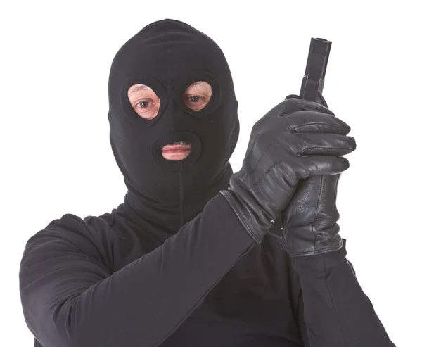 Грабитель с изолированным пистолетом — стоковое фото