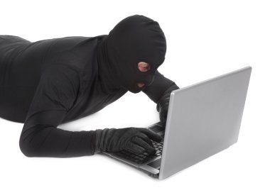 Data thief with laptop clipart