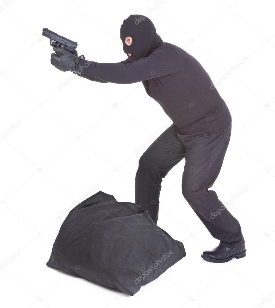 Robber aiming with his gun
