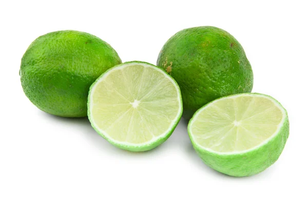 Limettenfrüchte auf Weiß — Stockfoto