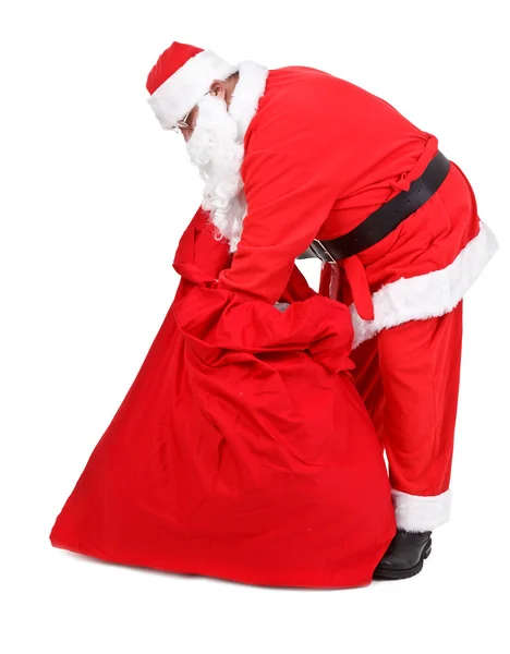Santa claus is op zoek naar giften — Stockfoto
