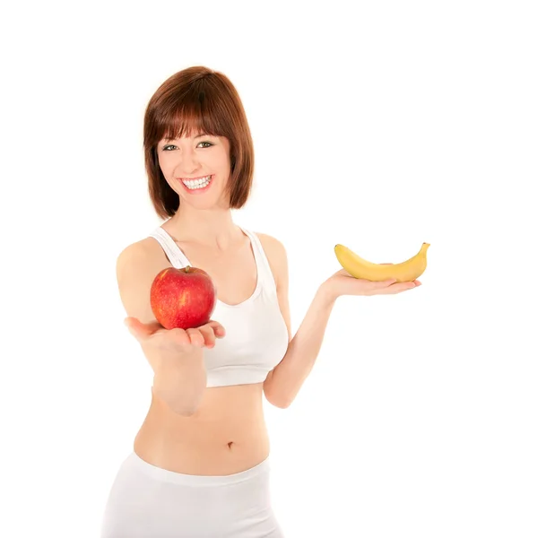 Portrait of a healthy young woman with apple and banana — Stock Photo, Image
