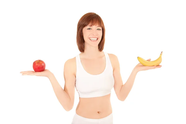 Портрет здорової молодої жінки з яблуком і бананом — стокове фото