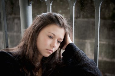 Teenage girl looking thoughtful about troubles clipart