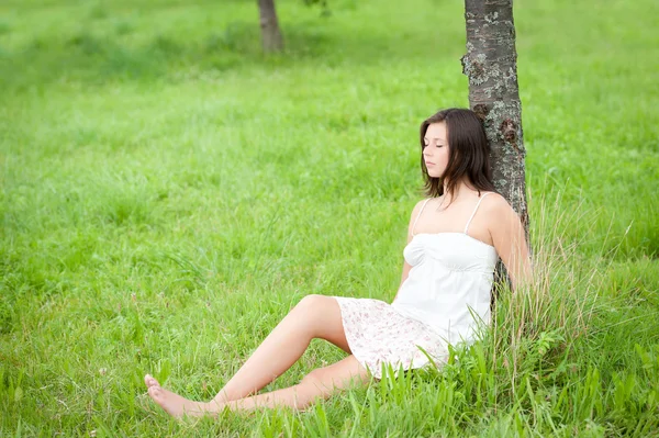 Outdoor portrait of a cute resting teen — Stock Photo, Image