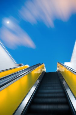 Escalator under the sunset glow clipart