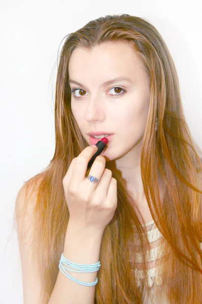 Pretty girl and lipstick — Stock Photo, Image