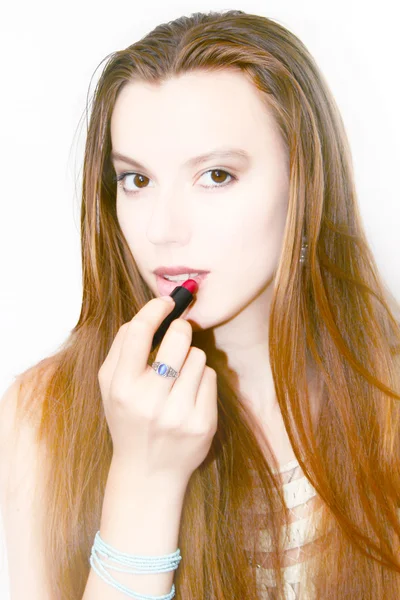 Pretty girl and lipstick — Stock Photo, Image