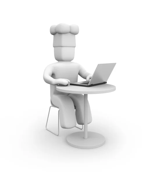 Головний кухар працює на ноутбуці — стокове фото