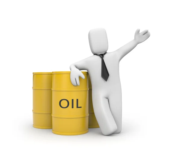 Бизнесмен с баррелями нефти — стоковое фото