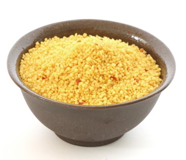 Brown bowl with couscous on white background clipart