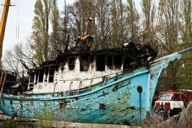 Old wooden ship on fire clipart