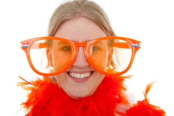 Portrait of a soccer supporter with big orange glasses — Stock Photo, Image