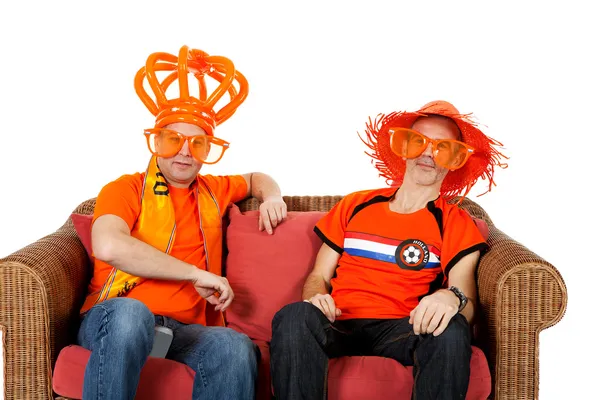 Two Dutch soccer fan watching game Royalty Free Stock Images