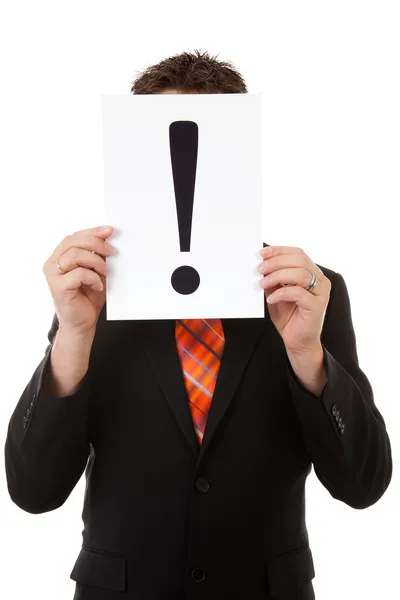 Businessman is holding a exclamation mark — Stock Photo, Image