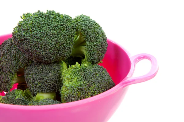 Pink colander with broccoli vegetable — Stock Photo, Image