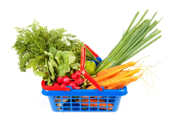 Shopping basket filled with healthy vegetables Stock Photo