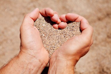 Hands filled with sand clipart