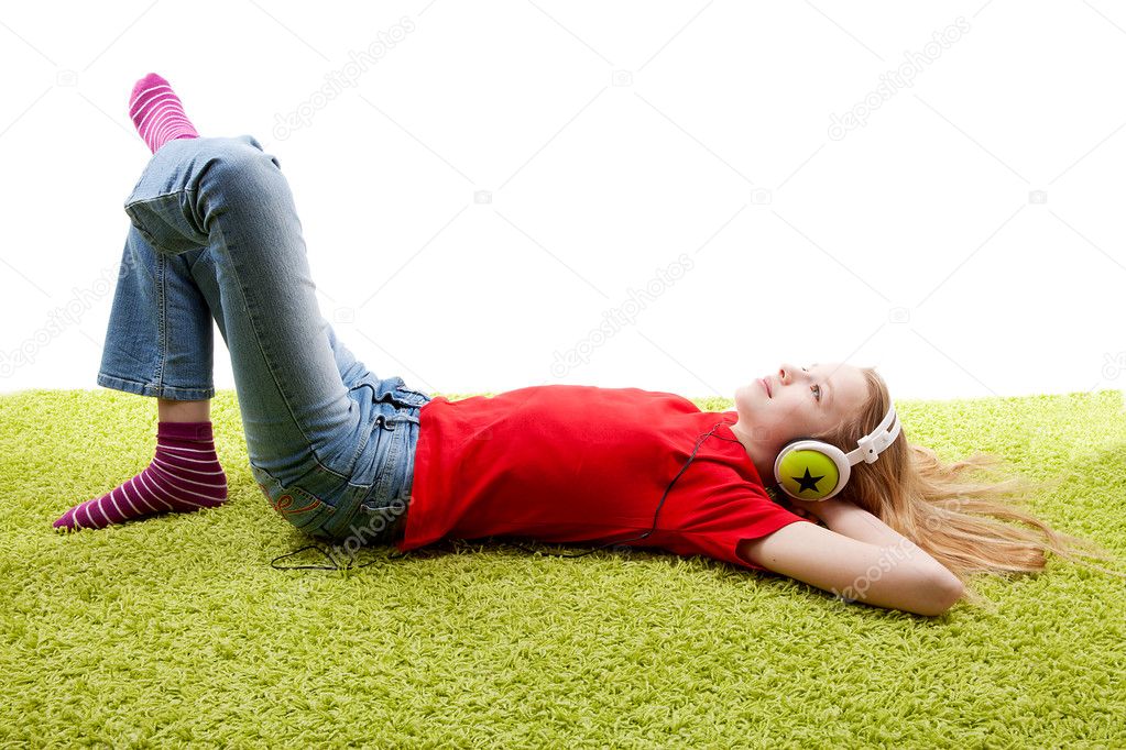 Girl is listening to music with headphones on