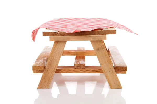 Empty picnic table with tablecloth — Stock Photo, Image