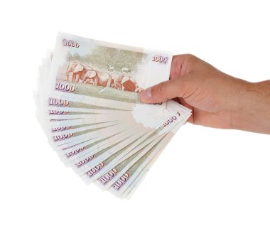 Hand holding Kenyan currency clipart
