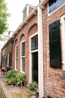 Street with typical Dutch houses clipart