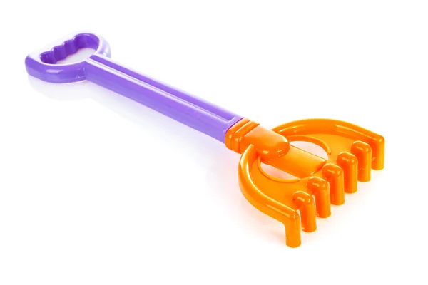 Colorful plastic rake — Stock Photo, Image