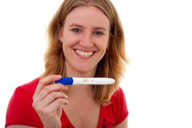 Woman with pregnancy tast is smiling clipart