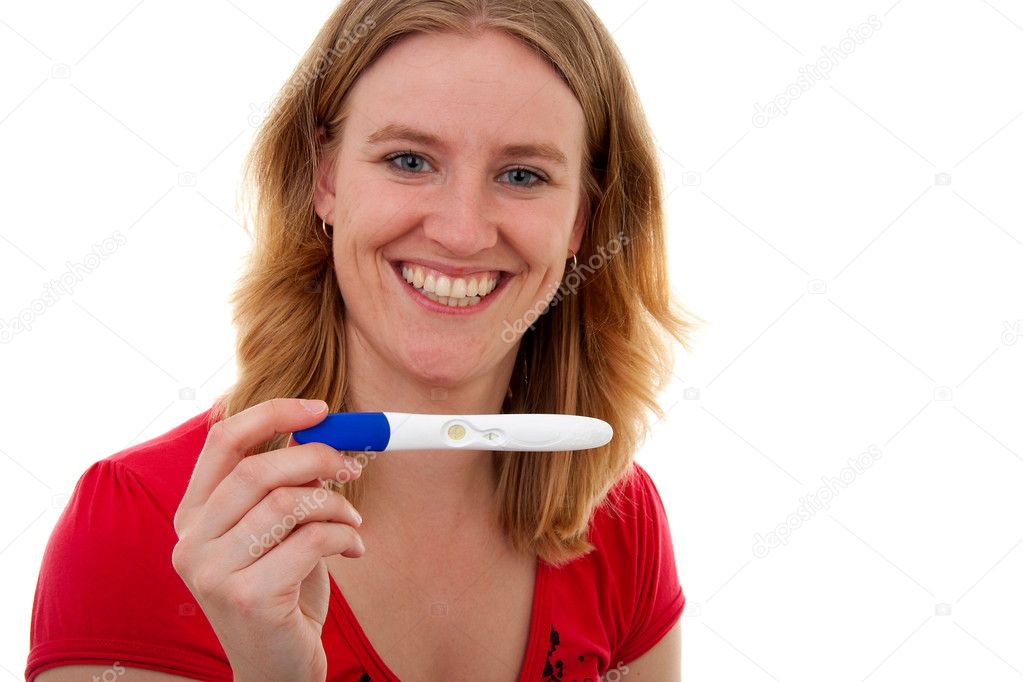 Woman with pregnancy tast is smiling