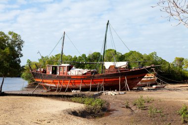 Old African boat on land clipart