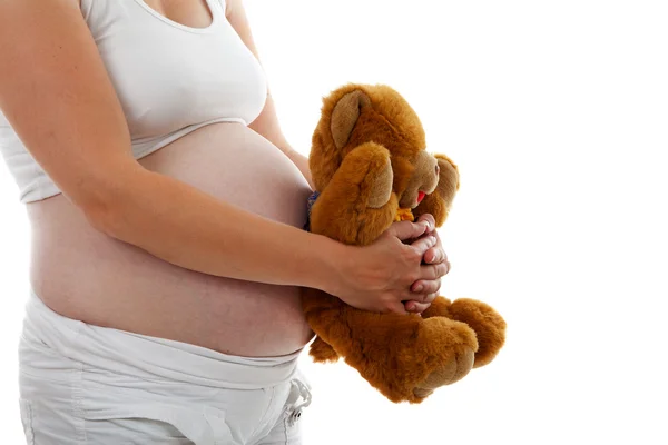 孕妇腹部与泰迪熊 — 图库照片