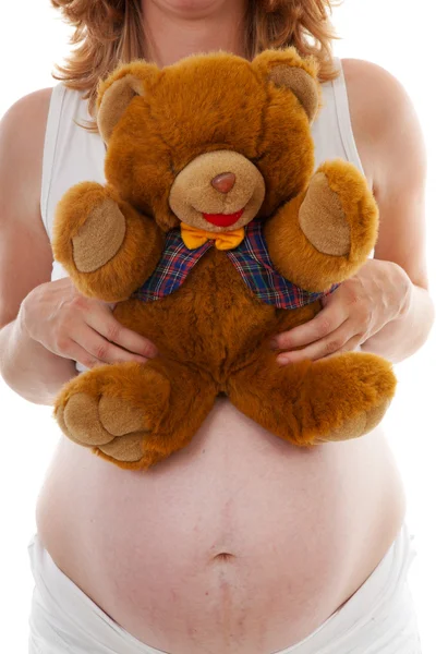 孕妇腹部与泰迪熊 — 图库照片