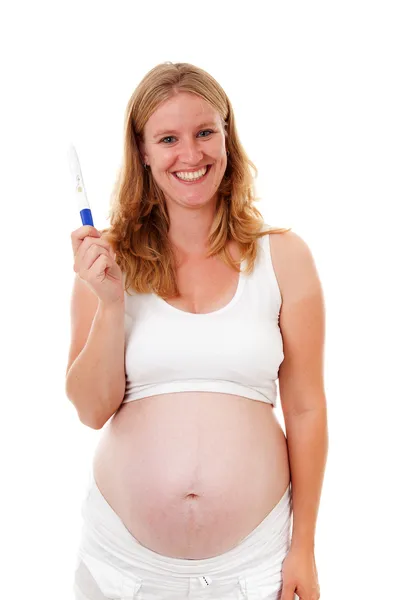 Mulher está segurando teste de gravidez — Fotografia de Stock