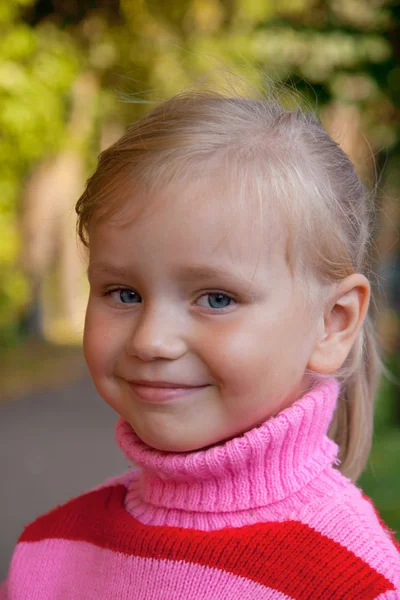 Little blond girl smiling portrait close up Royalty Free Stock Images