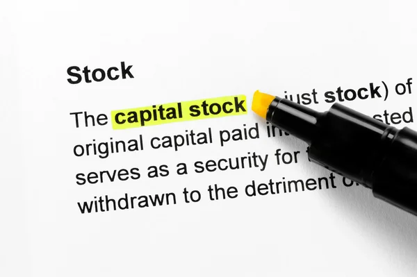 Capital stock text highlighted in yellow — Stock Photo, Image