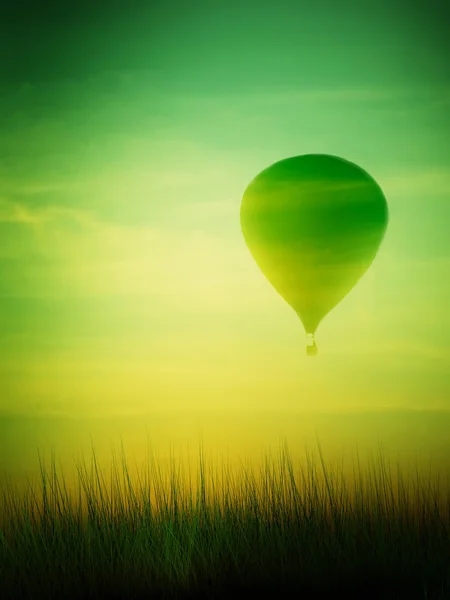 Hete luchtballon vliegen bij zonsopgang — Stockfoto